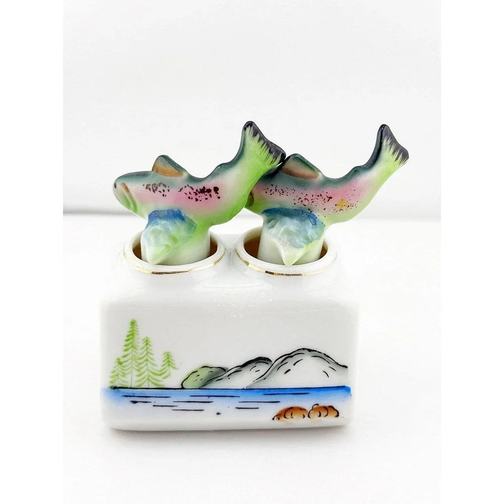 Vintage Japanese 1950's fish nodder salt & pepper shakers. Base shows fishing
